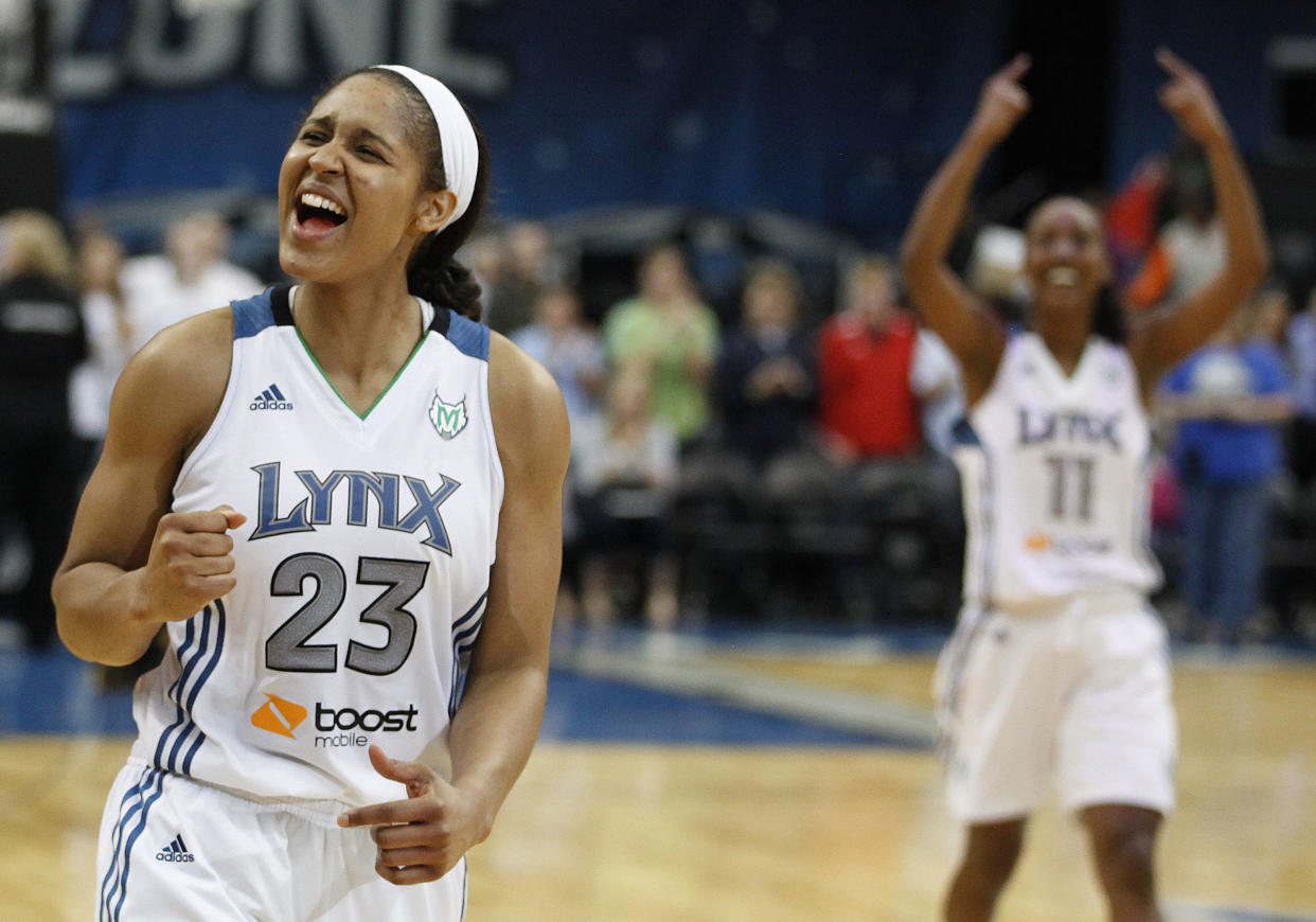 Maya Moore celebrates a Minnesota Lynx win in 2012. She officially announced her retirement from professional basketball on Monday. (AP Photo/Stacy Bengs)