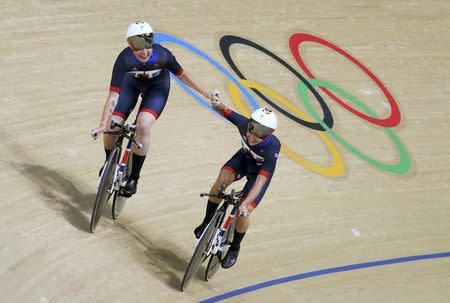 2016 Rio Olympics - Cycling Track - Preliminary - Women's Team Pursuit Qualifying - Rio Olympic Velodrome - Rio de Janeiro, Brazil - 11/08/2016. Laura Trott (GBR) of Great Britain and Kate Archibald (GBR) of Great Britain celebrate setting a world record. REUTERS/Paul Hanna