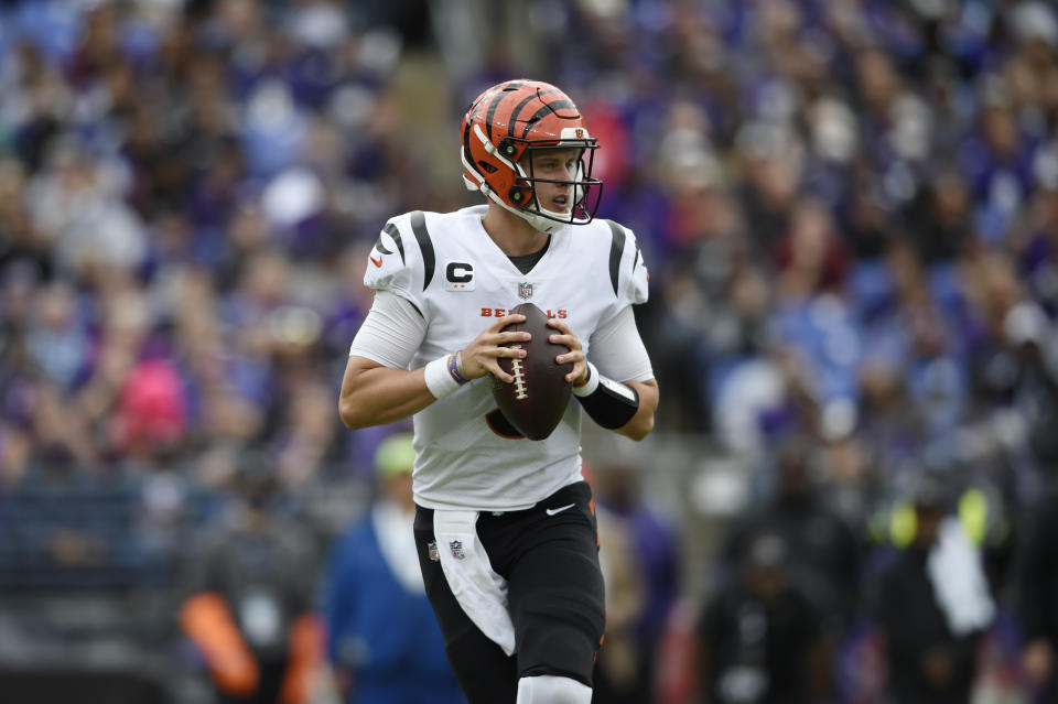 Joe Burrow leads the defending AFC champion Cincinnati Bengals into Baltimore to face Lamar Jackson and the Ravens. (AP Photo/Gail Burton)