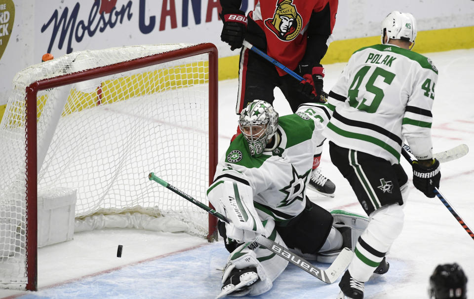 Dallas Stars goaltender Anton Khudobin (35) watches a shot by Ottawa Senators centre Jean-Gabriel Pageau enter the net during the first period of an NHL hockey game Sunday, Feb. 16, 2020, in Ottawa, Ontario. (Justin Tang/The Canadian Press via AP)