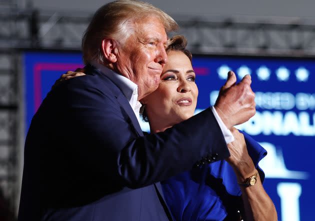 Former President Donald Trump embraces Arizona Republican gubernatorial nominee Kari Lake at a campaign rally at Legacy Sports USA on Sunday in Mesa, Arizona. Trump was stumping for Arizona GOP candidates ahead of the midterm election on Nov. 8. (Photo: Mario Tama via Getty Images)