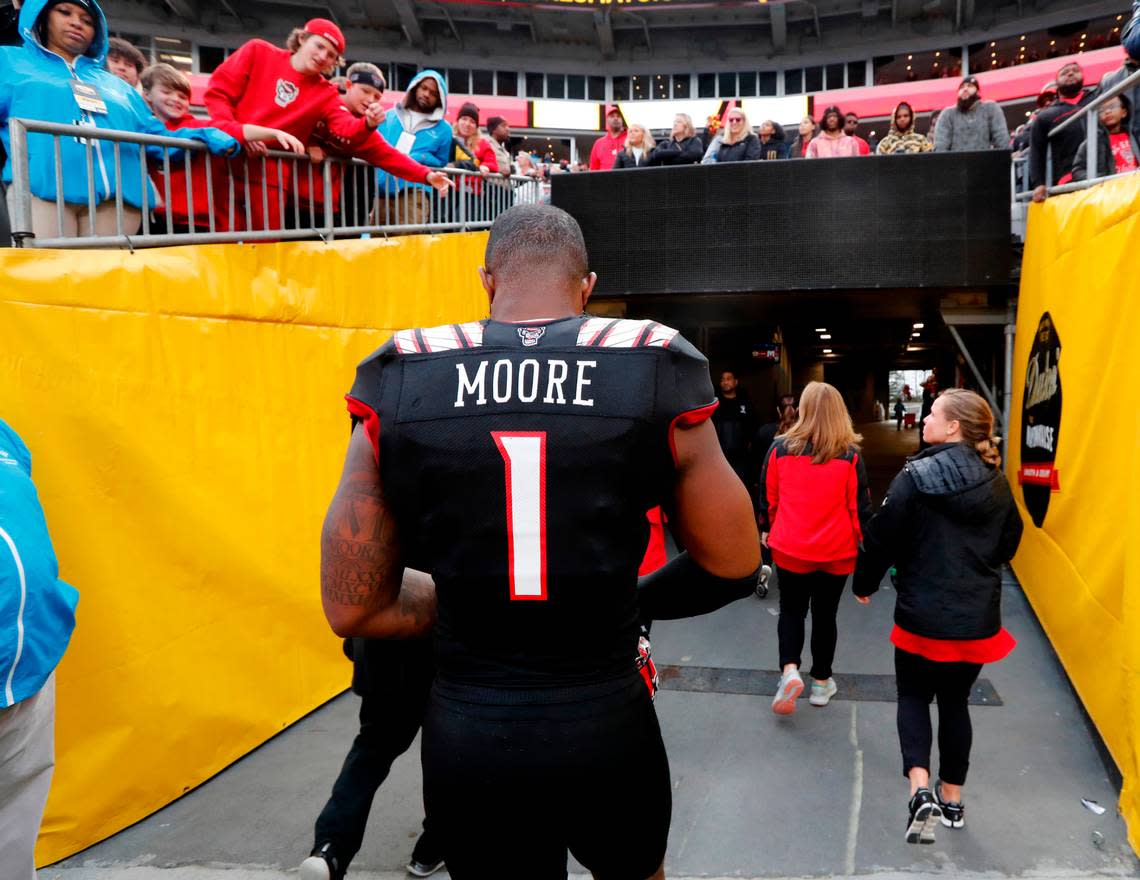 N.C. State linebacker Isaiah Moore (1) walks off the field after Maryland’s 16-12 victory over N.C. State in the Duke’s Mayo Bowl at Bank of America Stadium in Charlotte, N.C., Friday, Dec. 30, 2022.