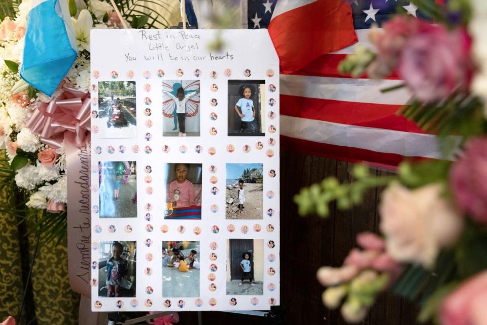 Photos of a young girl, taped in a grid onto white poster with stickers of Disney princesses, are displayed amongst flowers