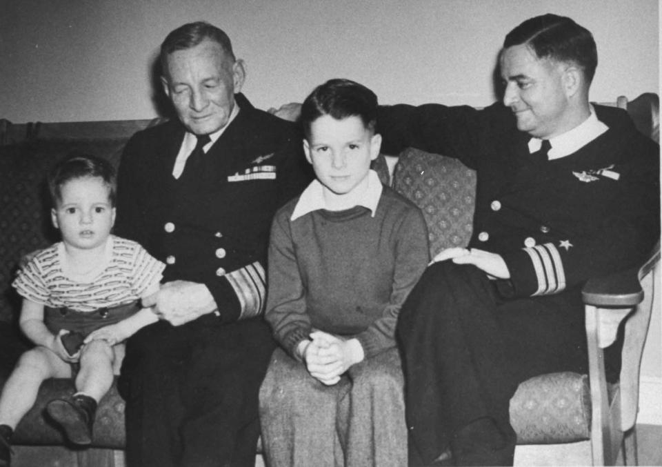 McCain as a young boy with his grandfather, Vice Admiral John S. McCain Sr., and father, Commander John S. McCain Jr., in a family photo from the 1940s.