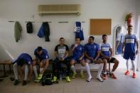 Players from Ariel Municipal Soccer Club, who are affiliated with Israel Football Association, wait in their dressing room ahead of their match against Maccabi HaSharon Netanya at Ariel Municipal Soccer Club's training grounds in the West Bank Jewish settlement of Ariel September 23, 2016. Picture taken September 23, 2016. REUTERS/Amir Cohen