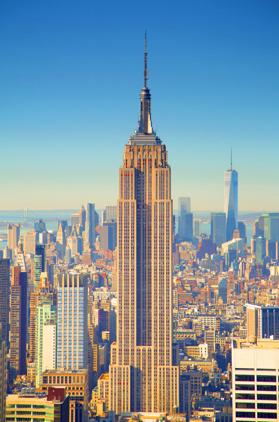 Empire State Building standing tall above NYC skyline in daylight