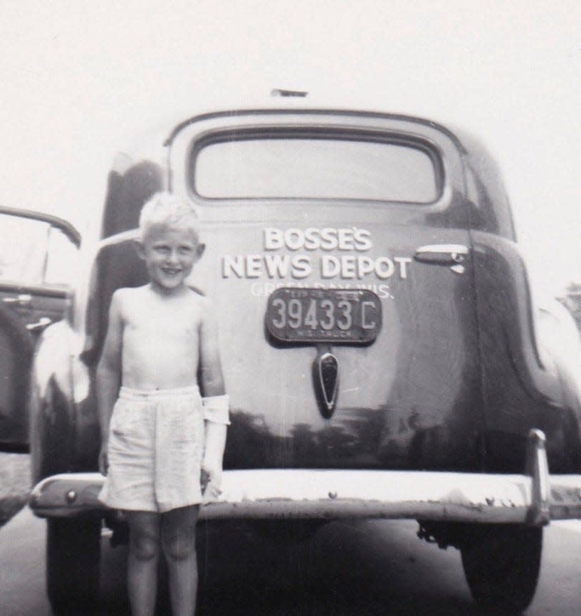 A photo of a young Steve Liebert next to a Bosse's News Depot vehicle.
