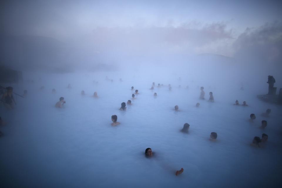 People relax in one of the Blue Lagoon hot springs near the town of Grindavik February 14, 2013. (Reuters)