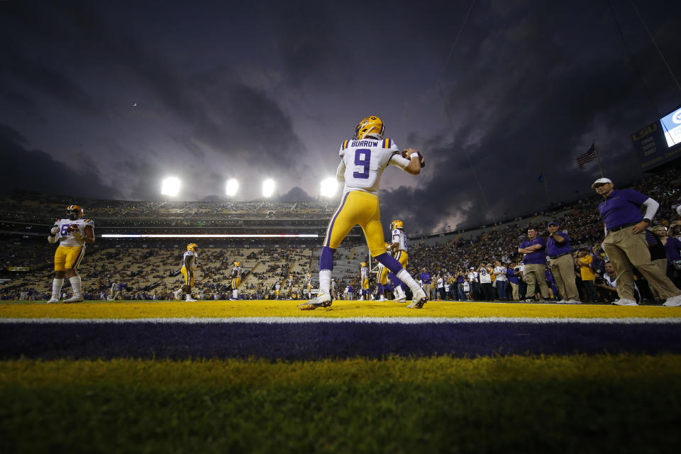 LSU quarterback Joe Burrow (9), a senior who is considered a frontrunner for the Heisman Trophy, warms up for his last NCAA college football game in Tiger Stadium, against Texas A&M in Baton Rouge, La., Saturday, Nov. 30, 2019. (AP Photo/Gerald Herbert)