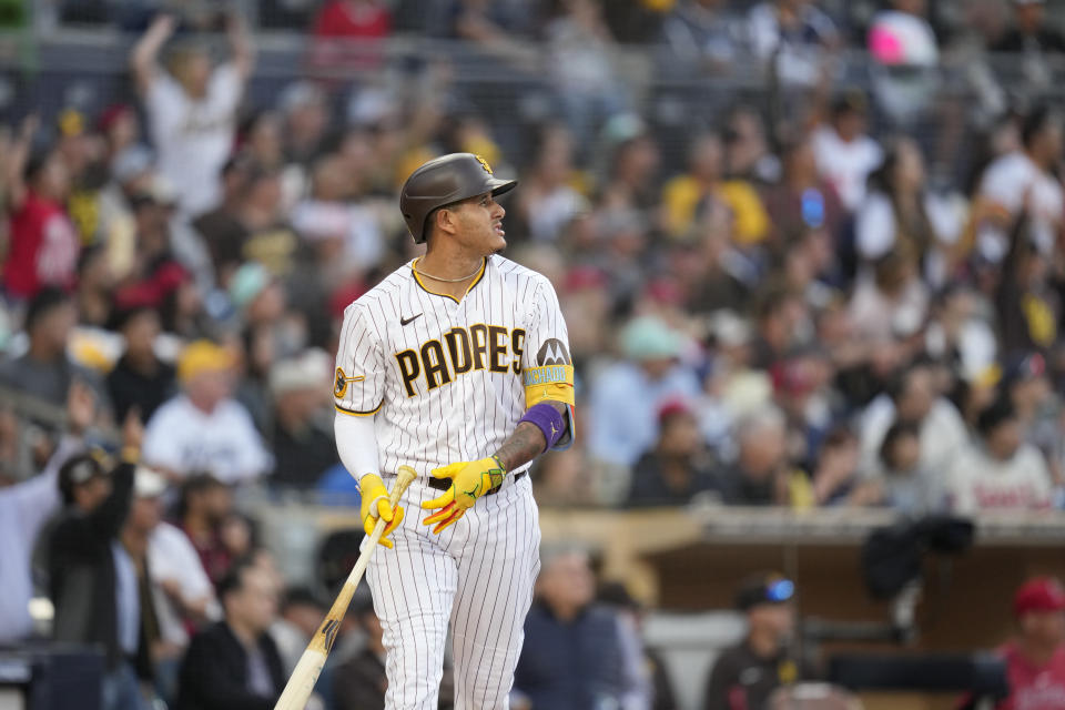 San Diego Padres' Manny Machado watches his home run during the sixth inning of a baseball game against the Los Angeles Angels, Wednesday, July 5, 2023, in San Diego. (AP Photo/Gregory Bull)