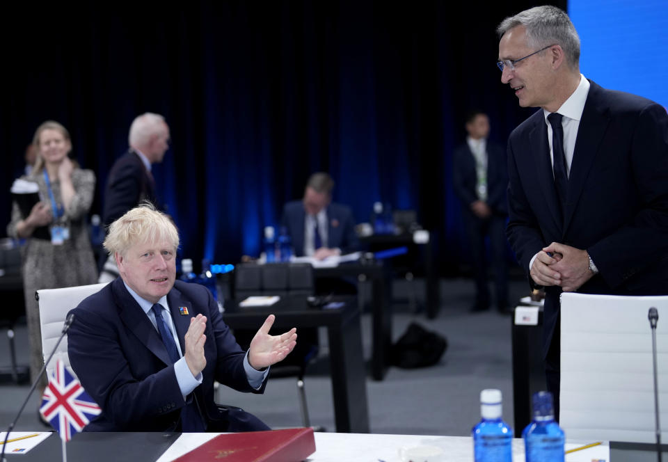 British Prime Minister Boris Johnson, left, and NATO Secretary General Jens Stoltenberg during a round table meeting at a NATO summit in Madrid, Spain on Thursday, June 30, 2022. North Atlantic Treaty Organization heads of state will meet for the final day of a NATO summit in Madrid on Thursday. (AP Photo/Bernat Armangue)