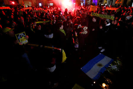 Fans gather near a row of yellow tulips in Nantes' city center after news that newly-signed Cardiff City soccer player Emiliano Sala was missing after the light aircraft he was travelling in disappeared between France and England the previous evening, according to France's civil aviation authority, France, January 22, 2019. REUTERS/Stephane Mahe