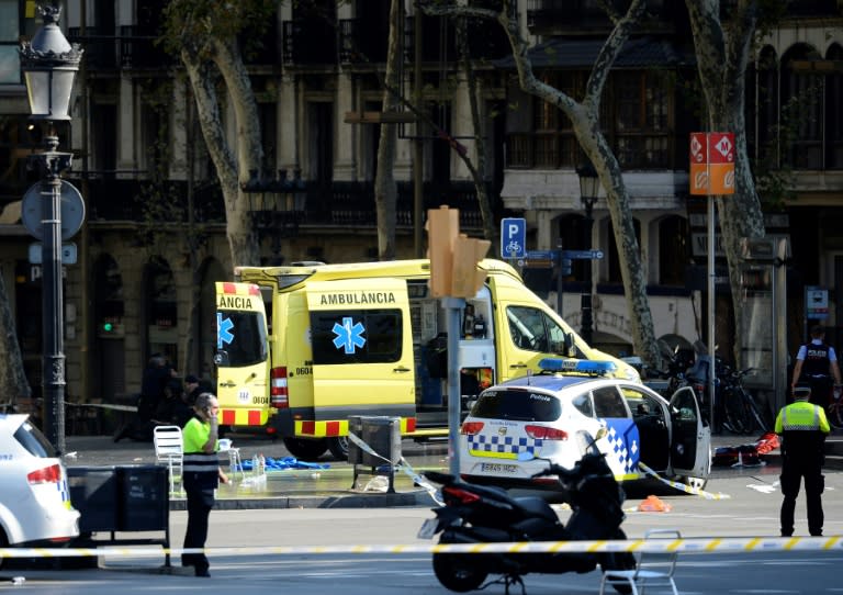 Police cordon off Barcelona's popular Las Ramblas area after a van drives into a crowd of people in what is described as a terrorist attack