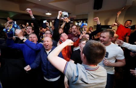 Britain Football Soccer - Leicester City fans watch the Chelsea v Tottenham Hotspur game in pub in Leicester - 2/5/16 Leicester City fans celebrate Chelsea's second goal Reuters / Eddie Keogh Livepic