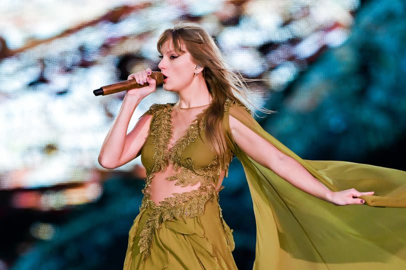 Taylor Swift performs on stage at Anfield.