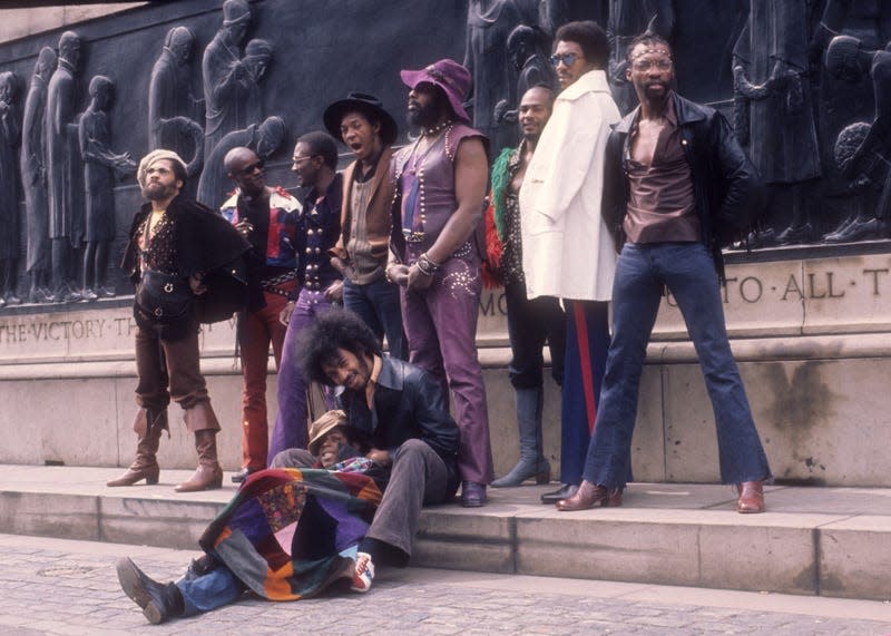 LIVERPOOL, ENGLAND - MAY 1971: (L-R) Fuzzy Haskins, Tawl Ross, Bernie Worrell, Tiki Fulwood, Grady Thomas, George Clinton, Ray Davis, Calvin Simon and seated Eddie Hazel and Billy “Bass” Nelson of the funk band Parliament-Funkadelic pose for a portrait in May 1971 in Liverpool, England.