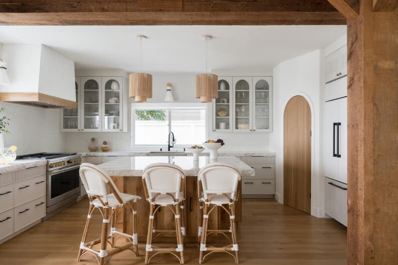 White kitchen with neutral accents.