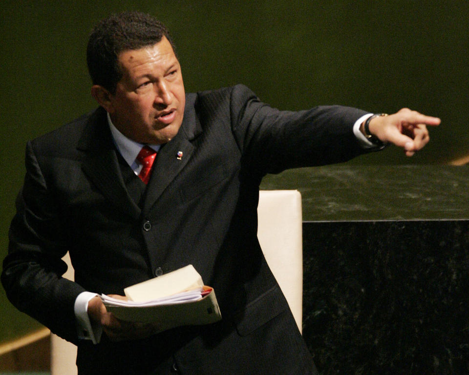 FILE - In this Sept. 20, 2006, file photo, Venezuela's President Hugo Chavez acknowledges members of the 61st session of the United Nations General Assembly at U.N. headquarters. Chavez drew gasps at the same forum in 2006 when he said of U.S. President George W. Bush, “yesterday, the devil came here,” adding that “it still smells of sulfur today.” (AP Photo/Julie Jacobson, File)