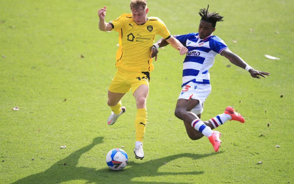 Reading's Omar Richards (right) and Barnsley's Kilian Ludewig during the Sky Bet Championship match at the Madejski Stadium, Reading. PA Photo. Picture date: Saturday September 19, 2020. See PA story SOCCER Reading. Photo credit should read: Adam Davy/PA Wire - PA/Adam Davy 