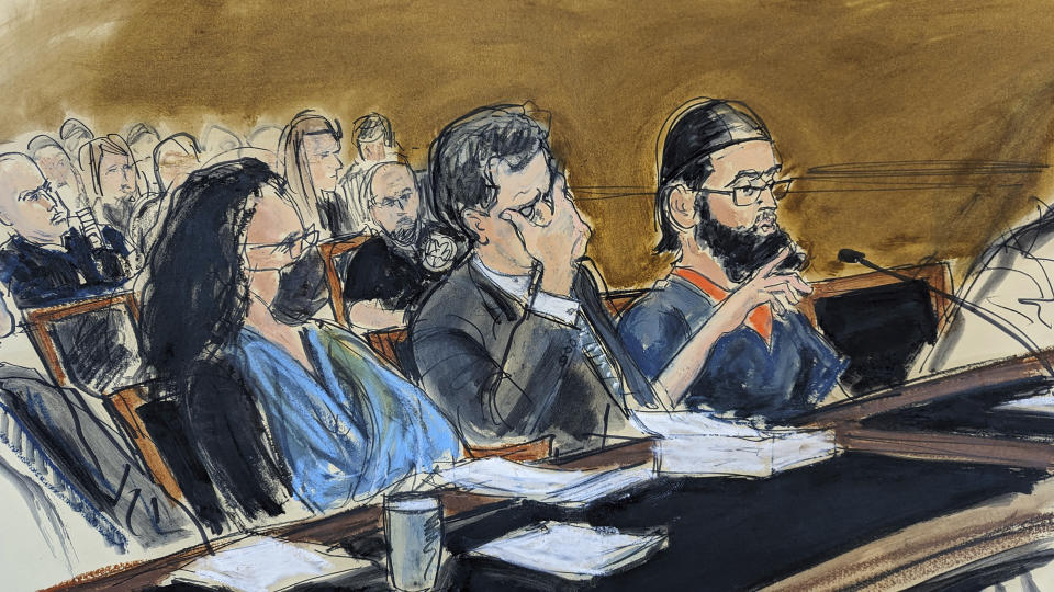 In this courtroom sketch, in federal court in New York, Wednesday, May 17, 2023, Sayfullo Saipov, right, speaks during the sentencing phase of his trial. Seated with Saipov are Federal defender Sylvie Levine, left, and attorney David M. Stern. He was given 10 life sentences and another 260 years in prison on Wednesday for killing eight people with a truck on a bike path in Manhattan and severely injuring 18 others. (AP Photo/Elizabeth Williams)