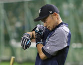 Seattle Mariners right fielder Ichiro Suzuki wipes his sweat during the team's batting practice prior to Game 1 of a Major League opening series baseball game against the Oakland Athletics at Tokyo Dome in Tokyo, Wednesday, March 20, 2019. (AP Photo/Toru Takahashi)