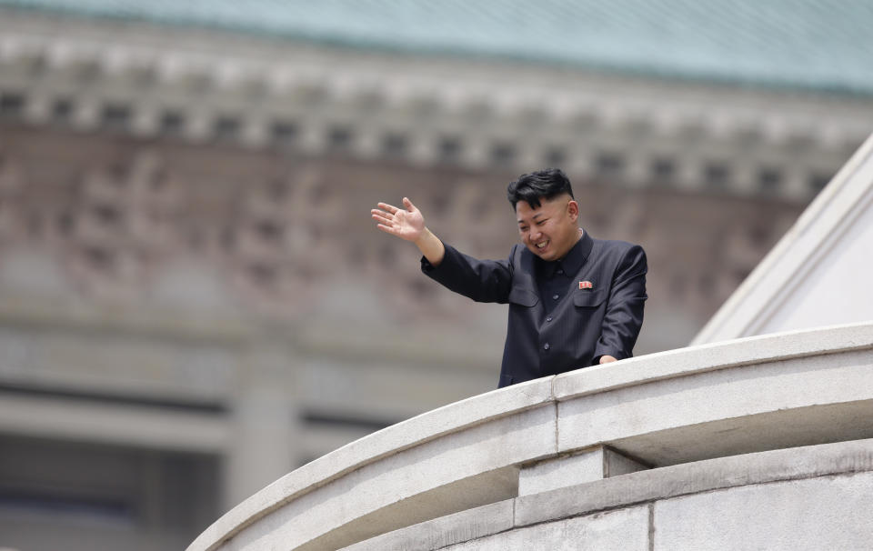 North Korean leader Kim Jong-un waves to the people during a parade to commemorate the 60th anniversary of the signing of a truce in the 1950-1953 Korean War, at Kim Il-sung Square in Pyongyang July 27, 2013. REUTERS/Jason Lee (NORTH KOREA - Tags: POLITICS MILITARY ANNIVERSARY TPX IMAGES OF THE DAY)