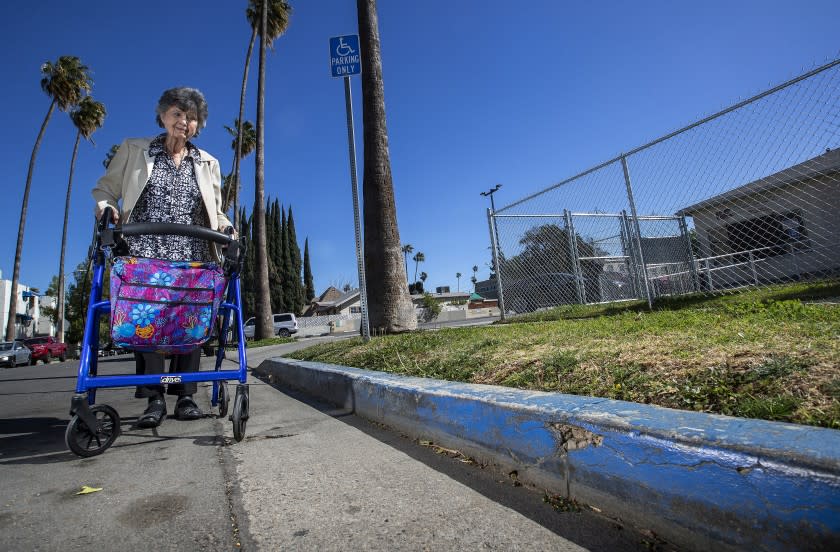 VAN NUYS, CA - FEBRUARY 17: Norma Vescovo, 84, retiring, executive director of the Independent Living Center of Southern California, a non profit she helped found in 1976, is photographed next to the first blue painted curb in the nation reserved for handicapped parking, that she helped create back in 1978. The blue curb is located in front of the service office for the Independent Living Center of Southern California on Haynes St. in Van Nuys. The center helps people with disabilities find jobs, solve problems, and get the benefits they're entitled to get. (Mel Melcon / Los Angeles Times)