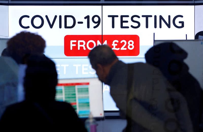 FILE PHOTO: Customers are seen inside a private COVID-19 testing clinic in a busy shopping area, amid the coronavirus disease (COVID-19) outbreak in London