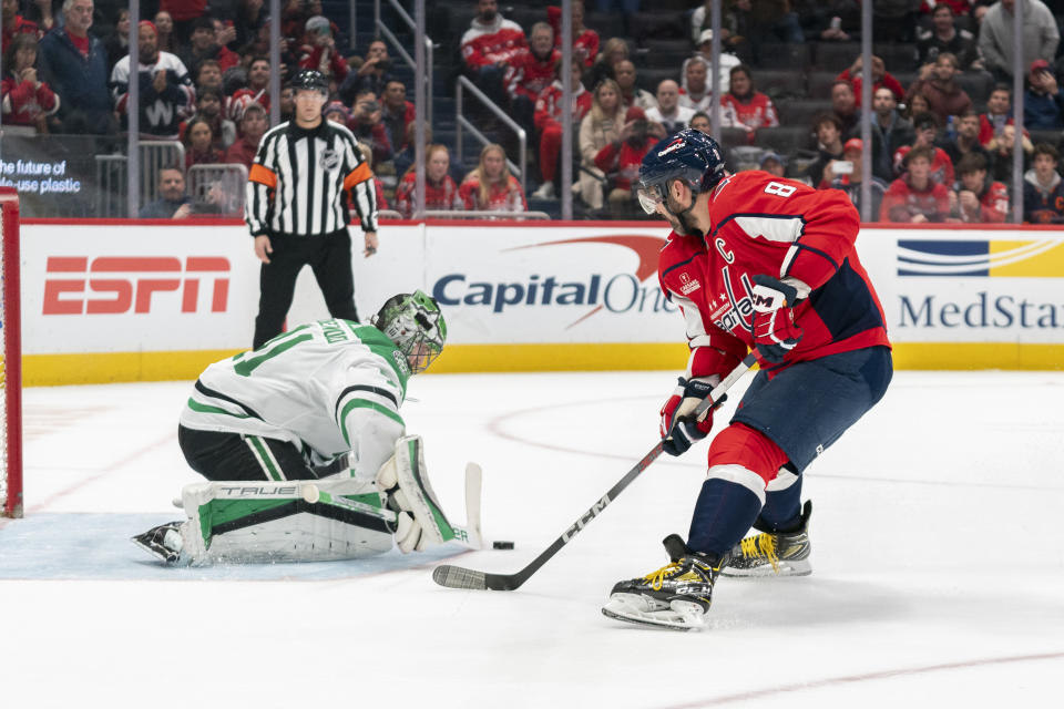 Dallas Stars goaltender Scott Wedgewood (41) deflects a shot by Washington Capitals left wing Alex Ovechkin (8) in a shootout during overtime of an NHL hockey game, Thursday, Dec. 7, 2023, in Washington. (AP Photo/Stephanie Scarbrough)