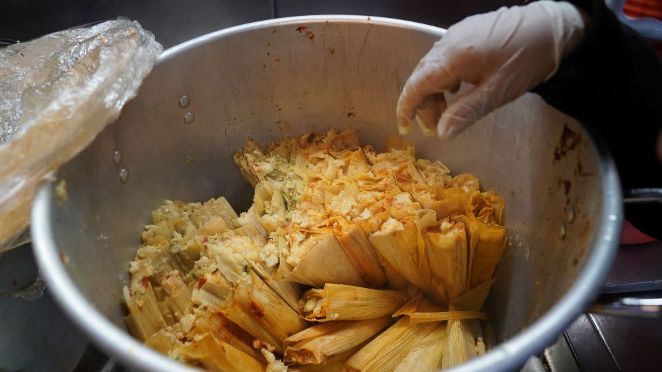 A street vendor sells tamales in New York City in November 2019. - Bryan R. Smith/AFP/Getty Images