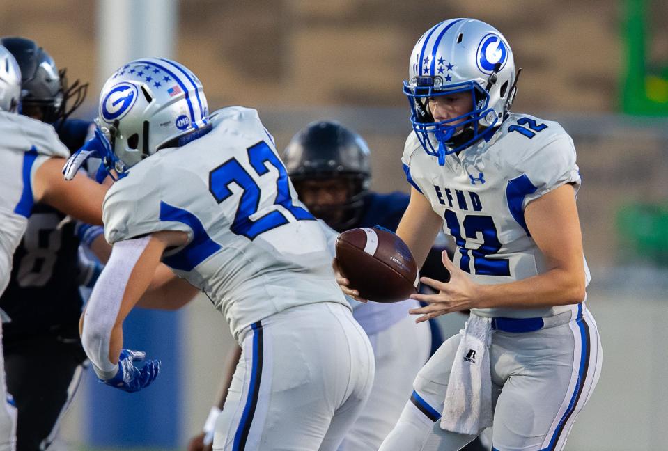 Georgetown quarterback Noah Booras fakes a handoff to running back Andrew Petter in the Eagles' 70-28 win over Hendrickson on Thursday night. Booras has thrown for 582 yards and six touchdowns in two games as a starter since replacing injured Tucker Griffin.