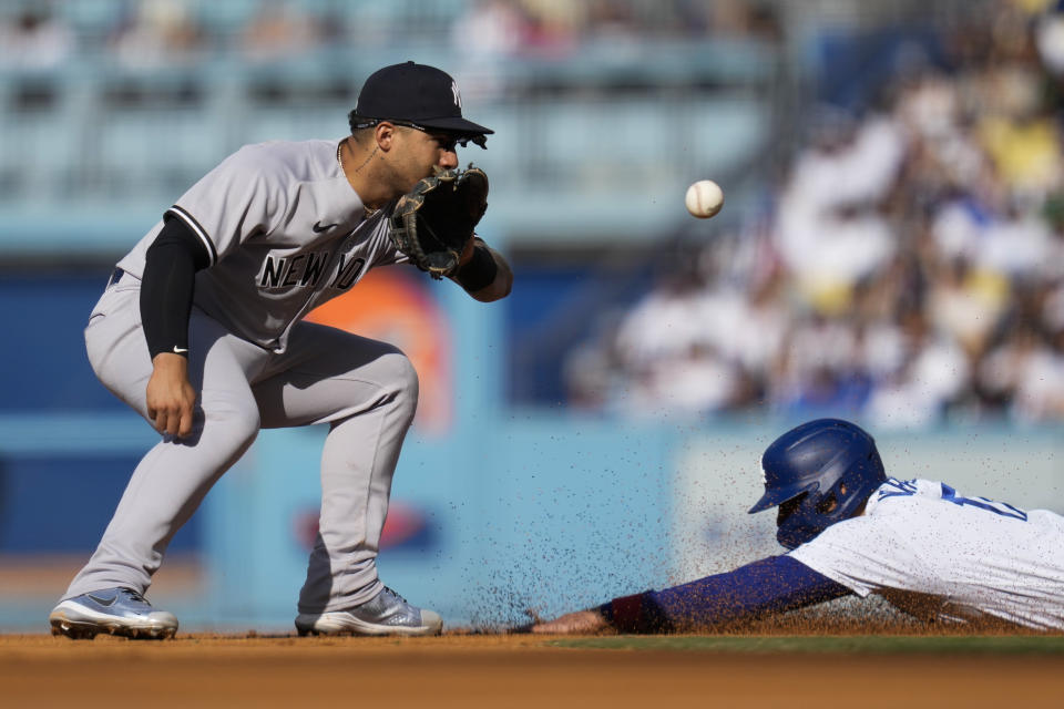 Los Angeles Dodgers' Miguel Vargas, right, is caught stealing second by New York Yankees second baseman Gleyber Torres (25) during the fifth inning of a baseball game in Los Angeles, Sunday, June 4, 2023. (AP Photo/Ashley Landis)