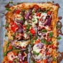 <p>Skip the mozzarella to make this a vegan pizza if you don't already have any in the house. All other ingredients can usually be found in your store cupboard.</p><p><a class="link " href="https://www.redonline.co.uk/food/recipes/a502912/tomato-and-pesto-filo-pizza/" rel="nofollow noopener" target="_blank" data-ylk="slk:SEE FULL RECIPE HERE;elm:context_link;itc:0;sec:content-canvas">SEE FULL RECIPE HERE</a></p>