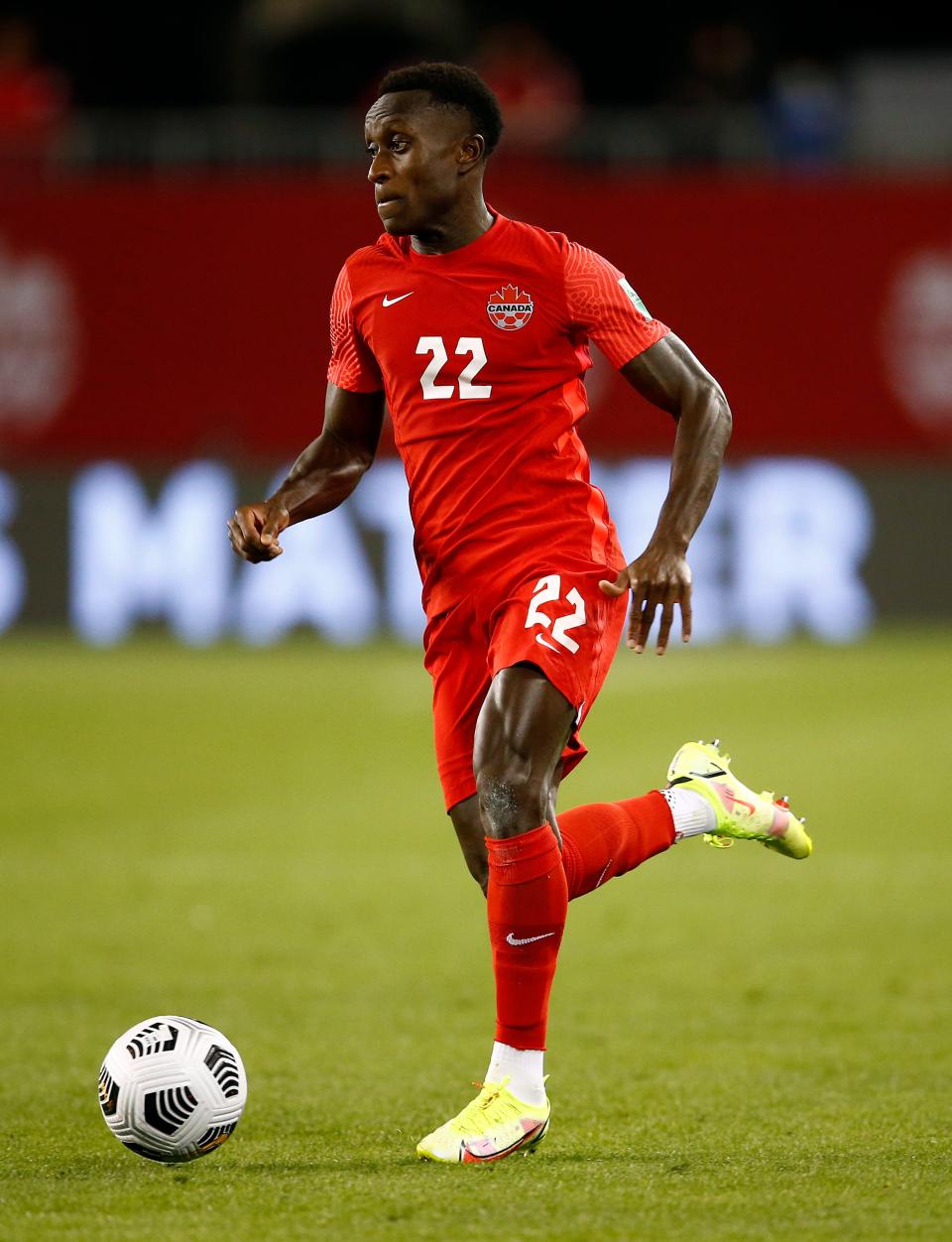 TORONTO, ON - SEPTEMBER 02:  Richie Laryea #22 of Canada dribbles the ball during a 2022 World Cup Qualifying match against Honduras at BMO Field on September 2, 2021 in Toronto, Ontario, Canada.  (Photo by Vaughn Ridley/Getty Images)