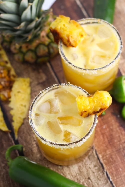 <p>Any excuse for margs, TBH.</p><p>Get the recipe from <a href="http://www.platingsandpairings.com/grilled-pineapple-jalapeno-margarita/" rel="nofollow noopener" target="_blank" data-ylk="slk:Platings & Pairings;elm:context_link;itc:0;sec:content-canvas" class="link ">Platings & Pairings</a>.</p>