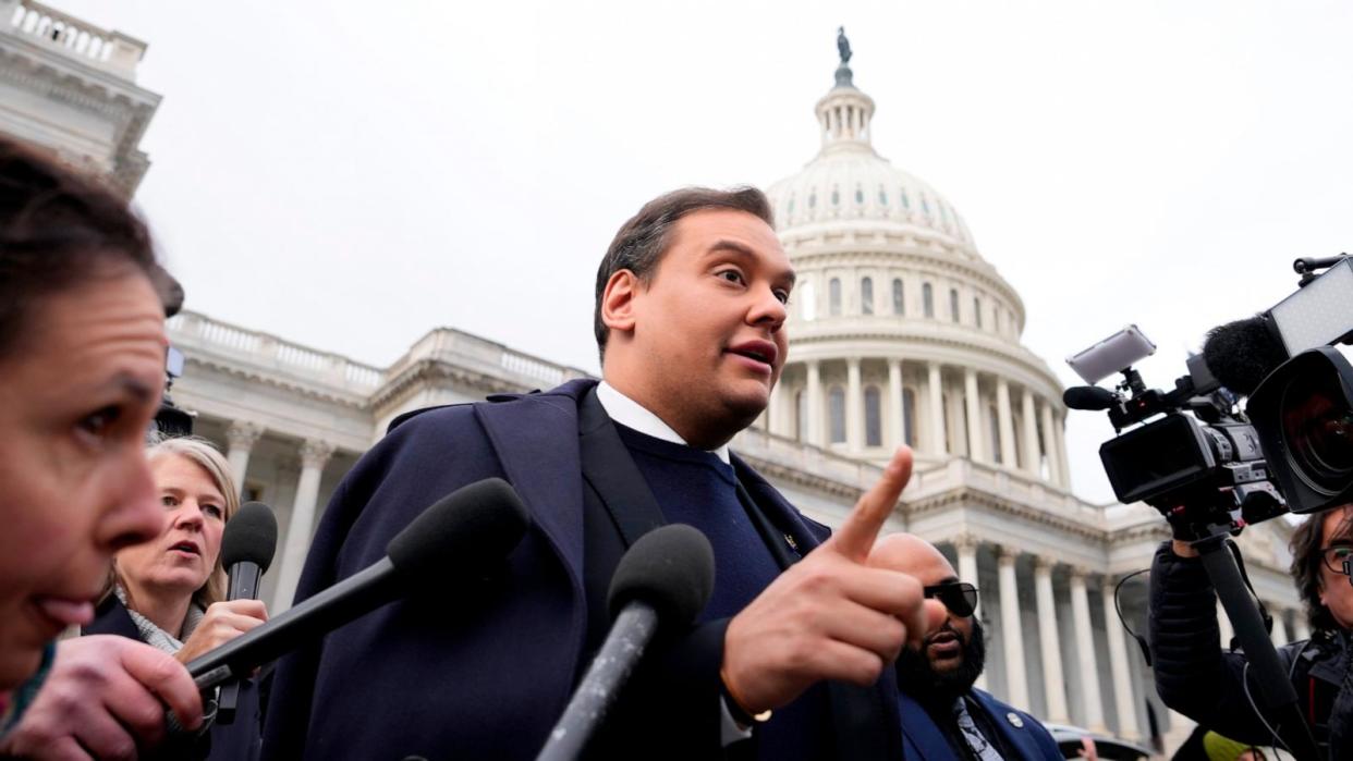 PHOTO: Rep. George Santos is surrounded by journalists as he leaves the Capitol after his fellow members of Congress voted to expel him from the House of Representatives, Dec. 1, 2023. (Drew Angerer/Getty Images)