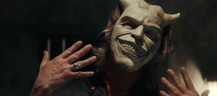 The Grabber wearing a smiling devil mask in "The Black Phone"