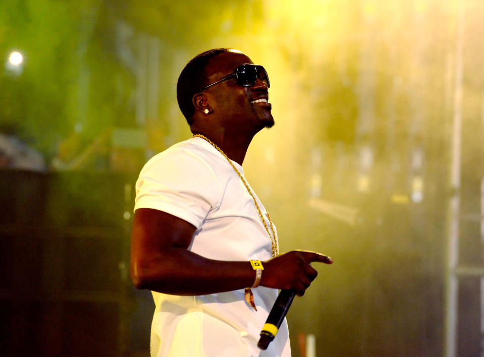 American singer Akon performing in a white t-shirt.