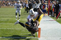 Pittsburgh Steelers running back Najee Harris (22) dives into the end zone with Las Vegas Raiders defensive back Johnathan Abram (24) defending for a touchdown during the second half of an NFL football game in Pittsburgh, Sunday, Sept. 19, 2021. (AP Photo/Keith Srakocic)