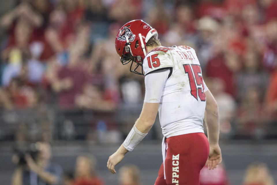 North Carolina State quarterback Ryan Finley (15) reacts after throwing an incomplete pass on third down down during the first half against Texas A&M in the Gator Bowl NCAA college football game Monday, Dec. 31, 2018, in Jacksonville, Fla. (James Gilbert/The Florida Times-Union via AP)