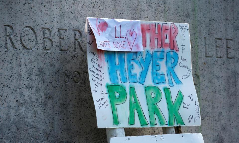 A sign on the statue of Robert E Lee calls for the park to be renamed for Heather Heyer, who was killed at the far-right rally, in Charlottesville, Virginia.