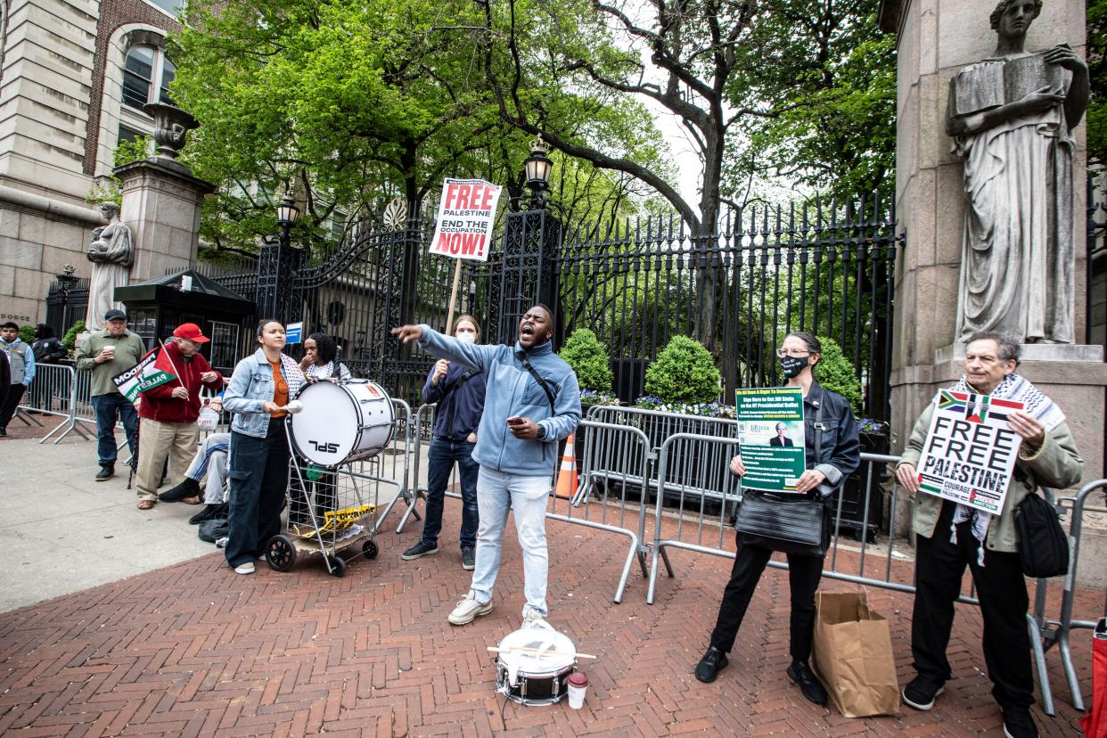 A group of protestors stand outside the gates of Columbia University in Manhattan on April 30, 2024.