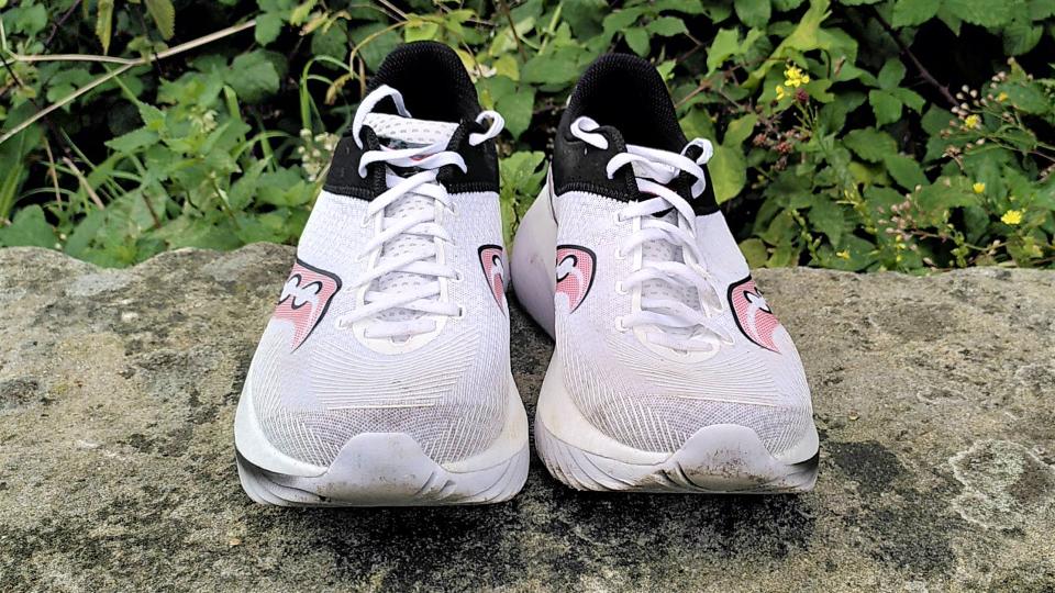 Saucony Kinvara Pro shoes on stone wall