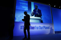 FILE - President Joe Biden walks off after speaking during an event about the "Global Methane Pledge" at the COP26 U.N. Climate Summit, Nov. 2, 2021, in Glasgow, Scotland, as John Kerry, United States Special Presidential Envoy for Climate takes the podium, shown on the screen. The U.S. has renewed legitimacy on global climate issues and will be able to inspire other nations in their own emissions-reducing efforts, experts said, after the Democrats pushed their big economic bill through the Senate on Sunday, Aug. 7. (AP Photo/Evan Vucci, File)