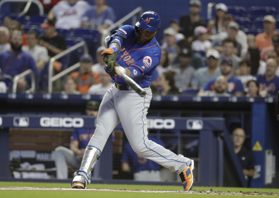 New York Mets' Robinson Cano line out to left field in the first inning during a baseball game against the Miami Marlins, Sunday, May 19, 2019, in Miami. (AP Photo/Lynne Sladky)