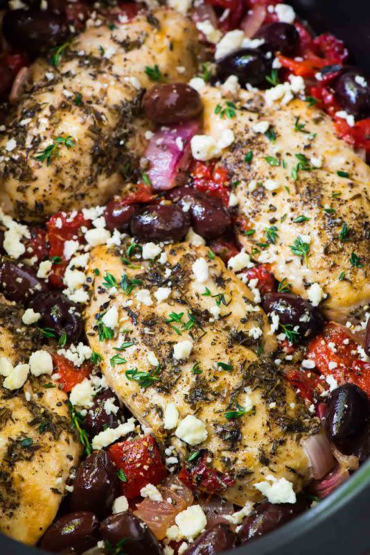<p>This juicy chicken has bright Mediterranean flavors, including olives, roasted red peppers, and feta. Get this <a href="https://www.wellplated.com/greek-chicken/" rel="nofollow noopener" target="_blank" data-ylk="slk:Slow Cooker Greek Chicken;elm:context_link;itc:0;sec:content-canvas" class="link rapid-noclick-resp">Slow Cooker Greek Chicken</a> recipe!</p>