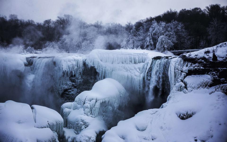 A partially frozen Niagara Falls is seen on the American side during sub-freezing temperatures in Niagara Falls, Ontario, March 3, 2014. REUTERS/Mark Blinch