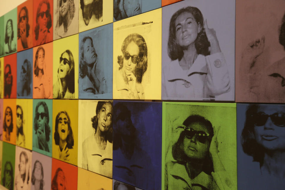 In this photo taken Wednesday, May 15, 2019, is the piece called "Ethel Scull 36 Times" at the exhibition, "Andy Warhol _ From A to B and Back Again" in San Francisco. A retrospective of Andy Warhol's work on display at the San Francisco Museum of Modern Art captures his use of artwork to give his subjects personas the way people do now using social media. (AP Photo/Eric Risberg)