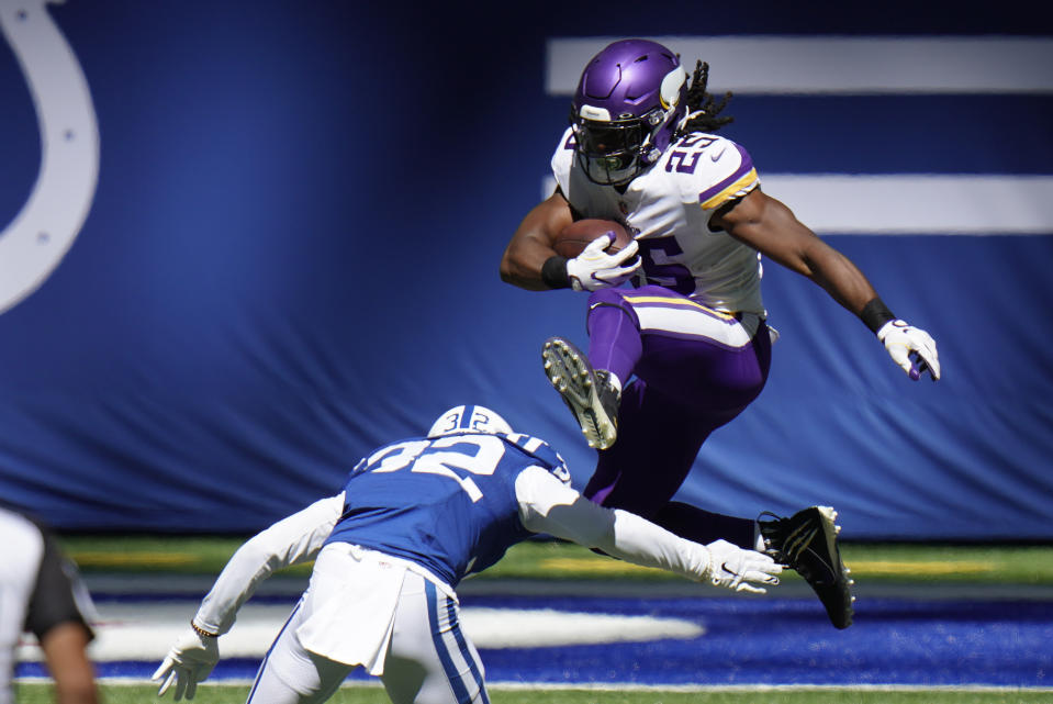 Minnesota Vikings' Alexander Mattison (25) leaps over Indianapolis Colts' Julian Blackmon (32) during the first half of an NFL football game, Sunday, Sept. 20, 2020, in Indianapolis. (AP Photo/AJ Mast)