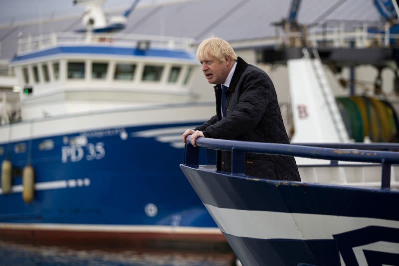 FILE PHOTO: Britain's Prime Minister Boris Johnson is seen aboard the Opportunus IV fishing trawler in Peterhead